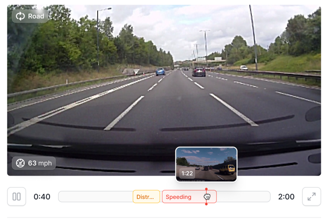 Live road-facing dashcam view at 63 mph with distraction and speeding events marked on the playback timeline